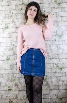 Female model posing on wall Stock Photos