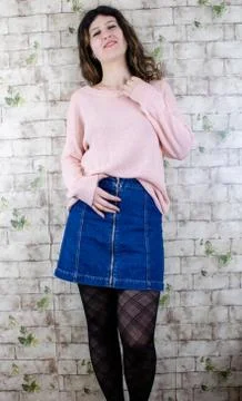 Female model posing on wall Stock Photos