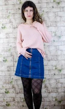 Female model posing on wall Stock Photos