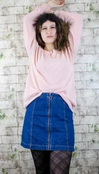 Female model posing on wall Stock Photos