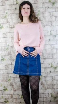 Female model posing on wall Stock Photos