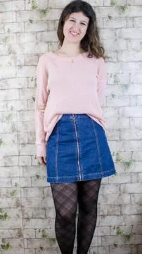 Female model posing on wall Stock Photos