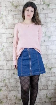 Female model posing on wall Stock Photos