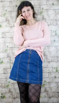 Female model posing on wall Stock Photos