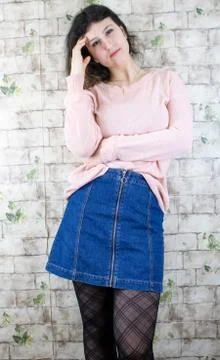 Female model posing on wall Stock Photos