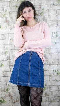 Female model posing on wall Stock Photos