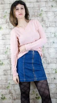 Female model posing on wall Stock Photos