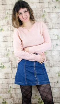 Female model posing on wall Stock Photos