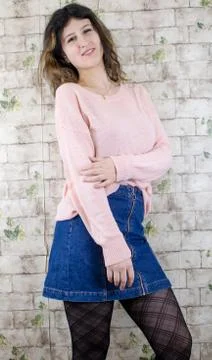 Female model posing on wall Stock Photos