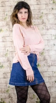 Female model posing on wall Stock Photos