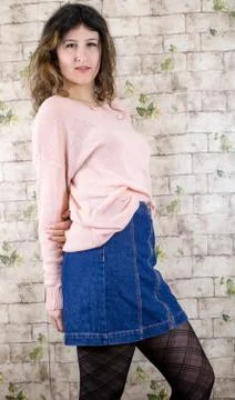 Female model posing on wall Stock Photos