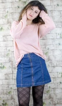Female model posing on wall Stock Photos