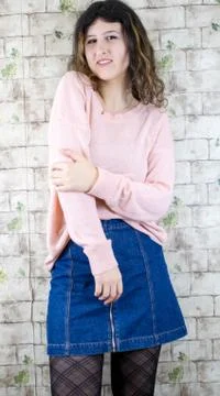 Female model posing on wall Stock Photos