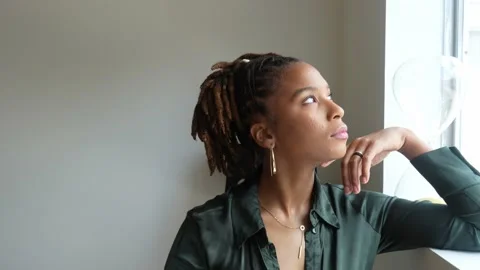 Female model posing by the window Stock Footage 196358622