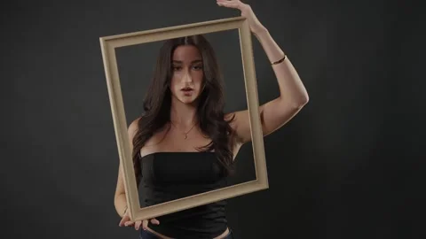 Female model posing with wooden frame, beauty and art concept, creative Stock Footage 336936671
