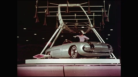 Female Model On Rotating Stage Presenting Futuristic Design Cabriolet Stock Footage 108285986