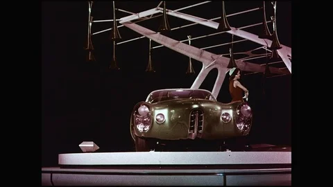 Female Model On Rotating Stage Presenting Futuristic Design Car Stock Footage 108286084