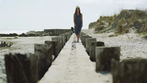 Female Model in Sea Shell Crown Walks Toward Camera in Slow Motion on Stock Footage 134962928