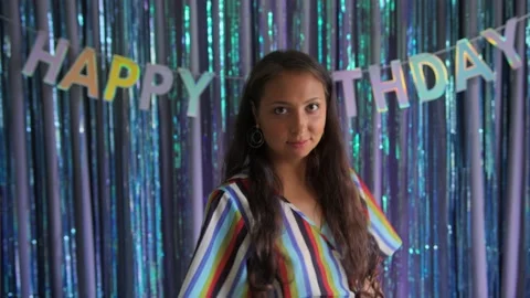 Female model smiles and dances looking at camera, happy birthday inscription Stock Footage 237165864