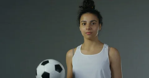 Female Model Throwing Classic Soccer ball Casually Into the Air Stock Footage 112765205