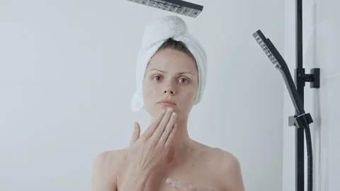 Female model using scrub for skin Stock Footage 200993506