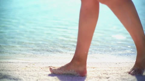 Female model walks on white sandy beach - Tropical Shore and Seaside Vacation Video stock 339931450