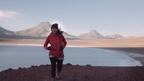 Female mountaineer running down. Stock Footage 84337555