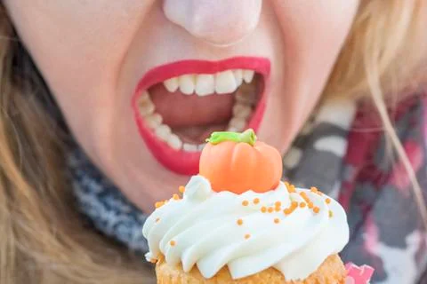 Female mouth eating a cake Stock Photos