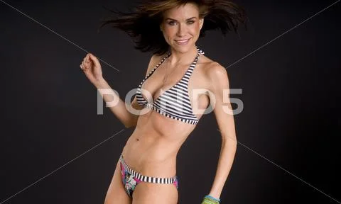 Female moves happily on camera Stock Photos