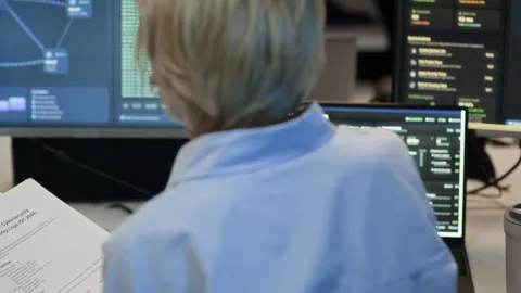 Female Network Engineer Monitoring Programming Codes on Computers in Office 스톡 동영상 334931439