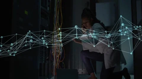 Female network engineer noticing animated alert and troubleshooting cables in Stock Footage 332577528
