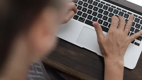 Female office worker typing on the keyboard Stock Footage 127795717