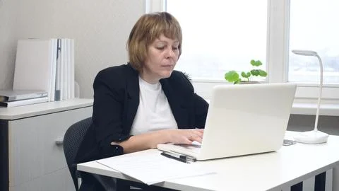 Female Office Worker Using Computer Stock Photos