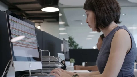 Female Office Workers Typing on Computers Stock Footage 85168506