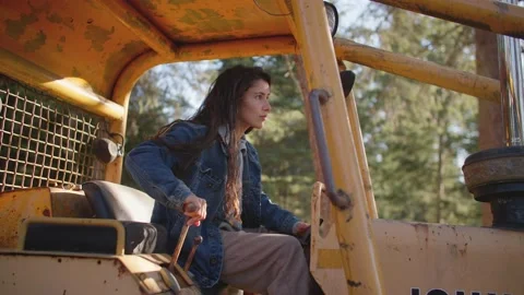 Female operating tractor Stock Footage 213487491