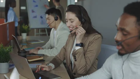 Female operator answering to customer query in call center Stock Footage 195928997