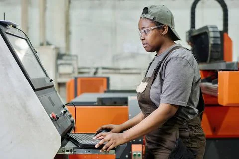 Female operator controlling the computer machine Stock Photos