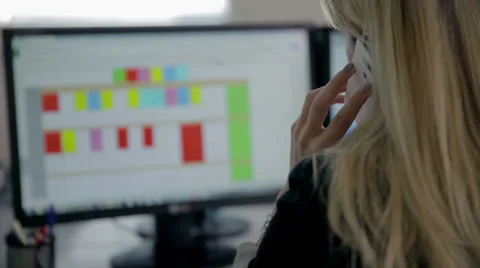 Female operator explaining something to a customer over the phone Video stock 35398927