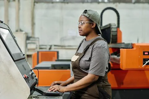 Female operator working on computer machine Stock Photos