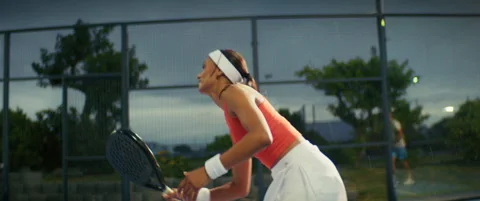 Female padel player showcasing skill and agility during a competitive sports mat Video stock 315590545