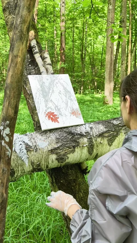 Female Painter From Behind Adding Final Touches to Botanical Abstract Stock Footage 336614073