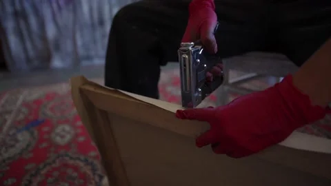 Female painter mounting canvas Stock Footage 142668545