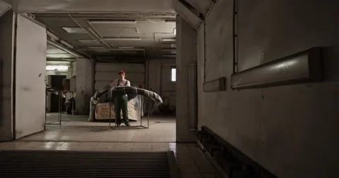 Female painter working on bumper Stock Footage 227171806