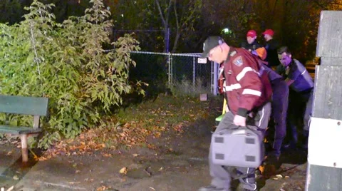 Female paramedic doing CPR while standing on high-tech ambulance stretcher Stock Footage 43541957