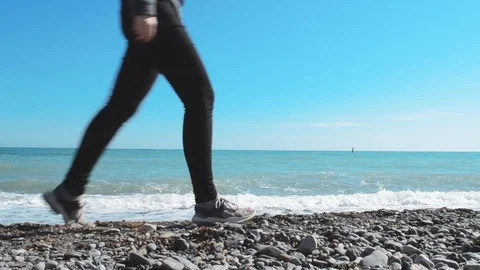 Female passing by on the beach Stock Footage 125802827