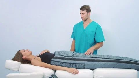 Female patient on pressotherapy treatment procedure Stock Footage