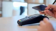 Female Paying Through Smart Phone Using Nfc Technology. Close-Up. 4K. Stock Footage