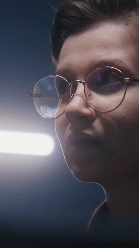 Female PC user looks on computer screen Stock Footage 277105103