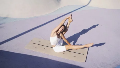 Female person does effective strength asana Stock Footage 272417854