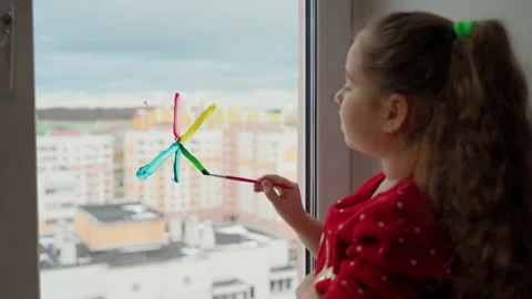 Female person school age using paints to decorate her room for christmas Stock Footage 166162974